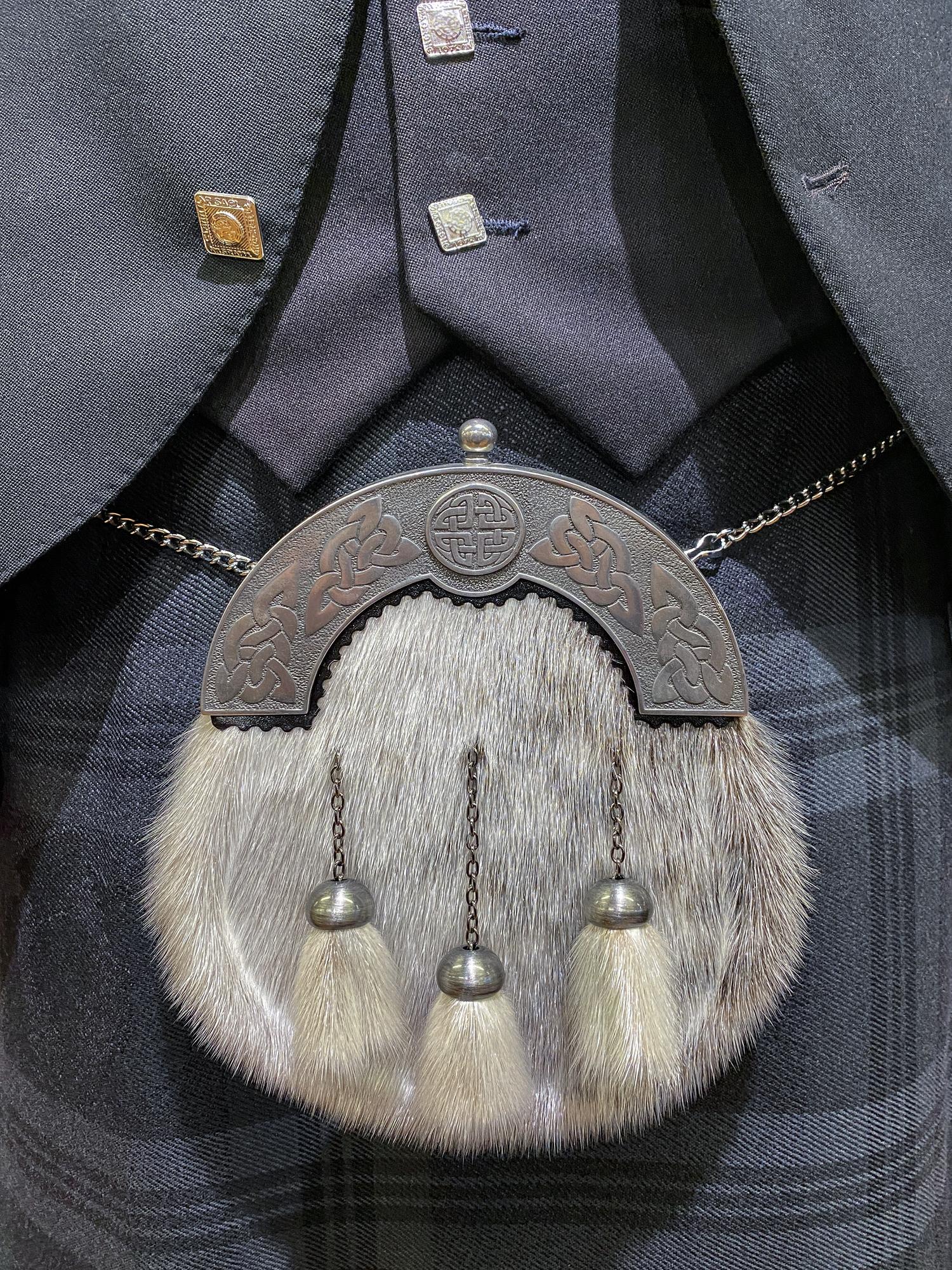 Embroidered jacket cuff with metallic thread