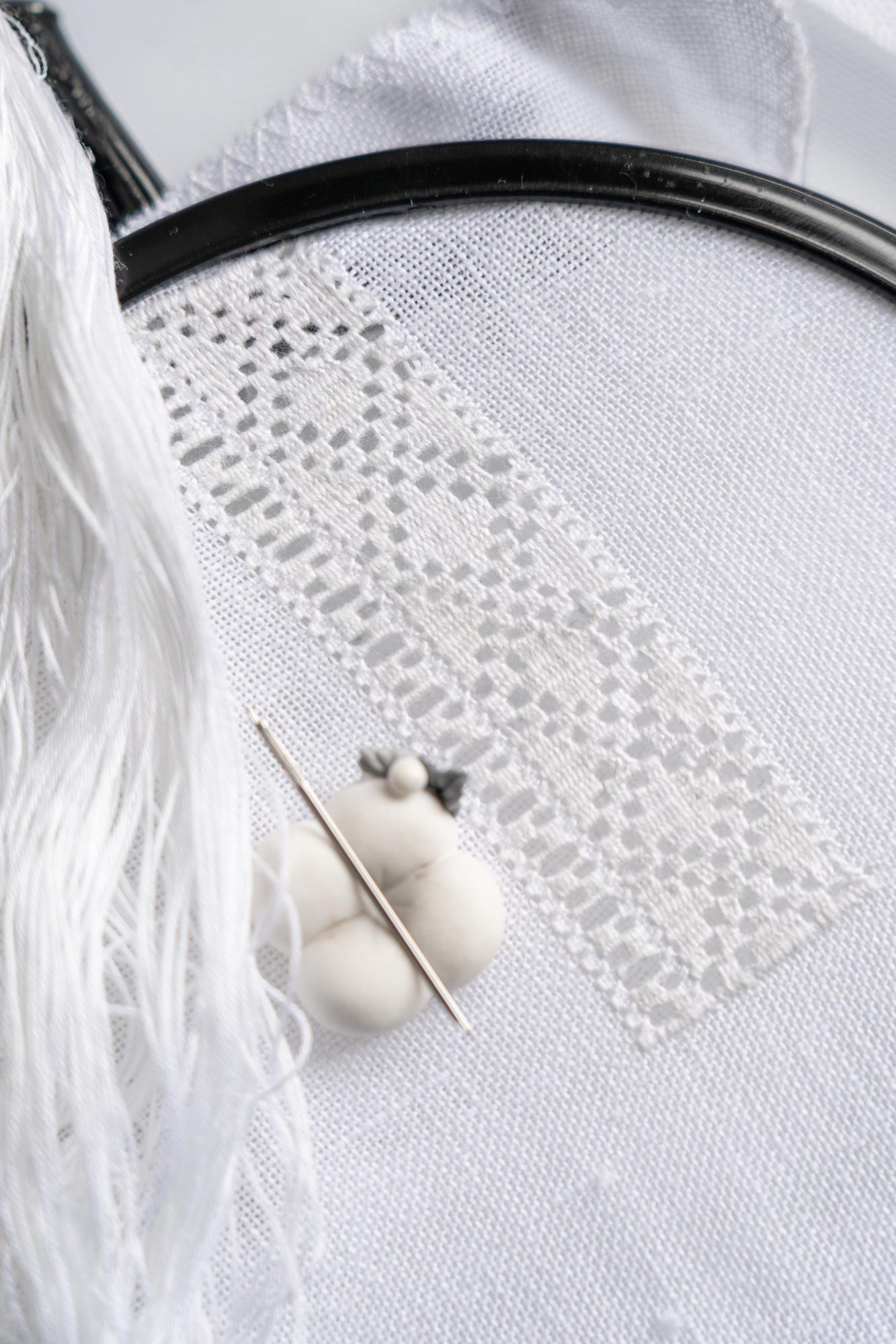 Hand embroidery sample on linen with floral motif